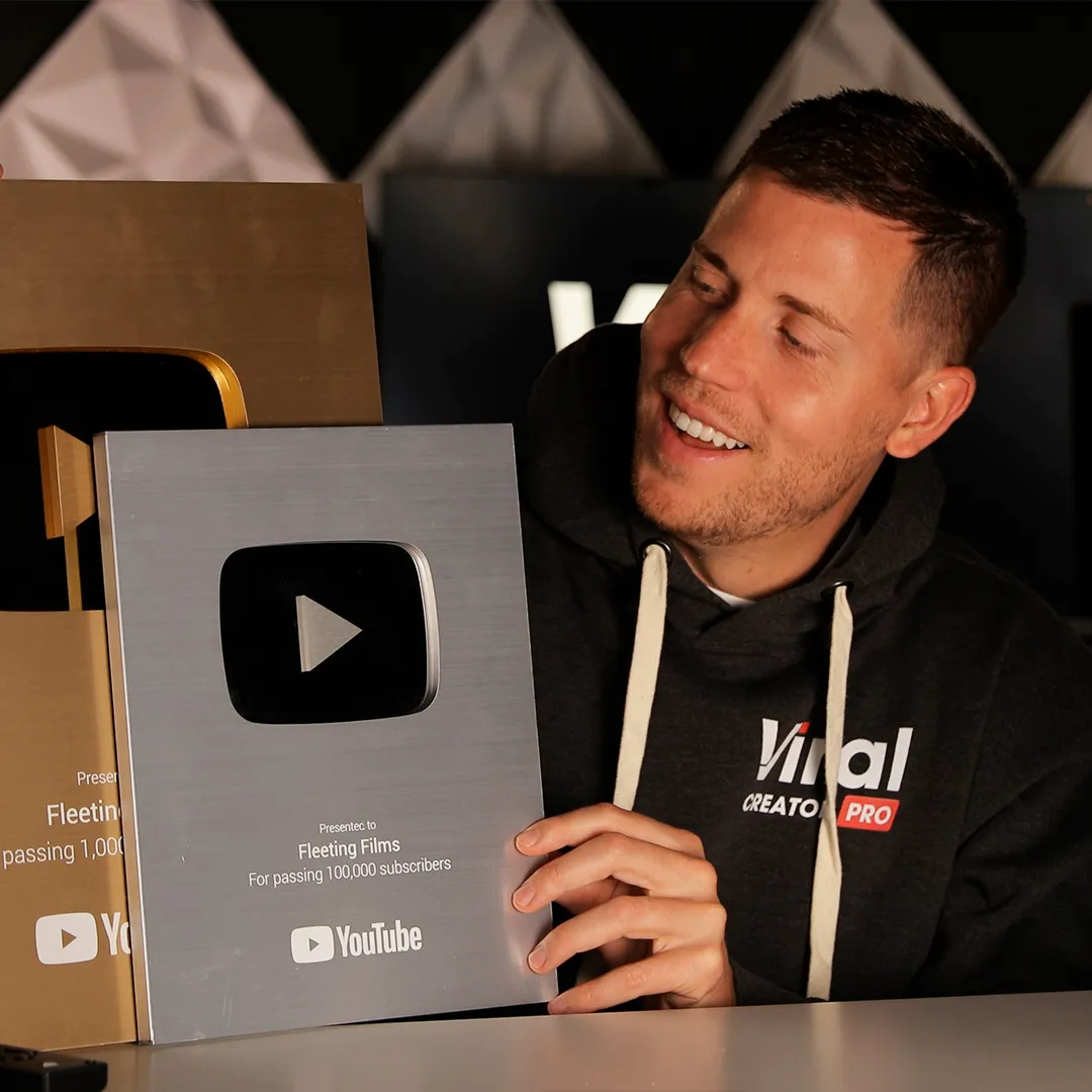 Matthew Watts holding a creator award